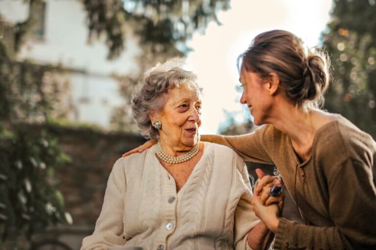 Young lady helping an elderly lady