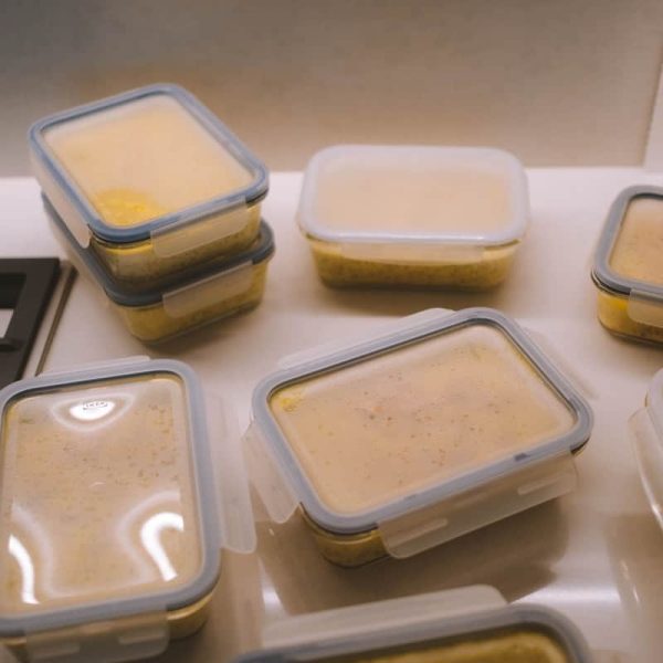 white plastic food container on white table