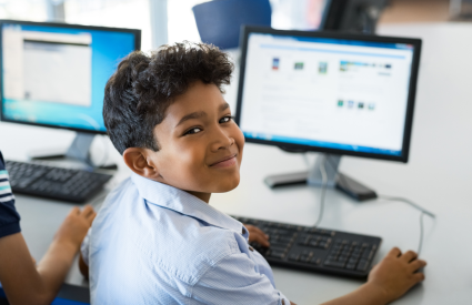 child on computer at school