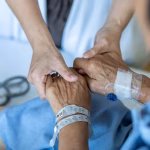 Elderly,Senior,Aged,Patient,On,Bed,With,Geriatric,Doctor,Holding