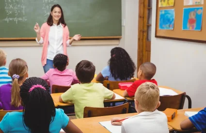 teacher in classroom with children students