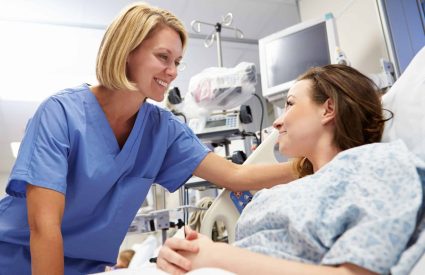 Young,Female,Patient,Talking,To,Nurse,In,Emergency,Room